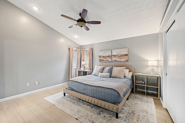 2361 Middlesex Rd, Upper Arlington, OH 43220 - bedroom featuring a textured ceiling, light wood finished floors, vaulted ceiling, and ceiling fan