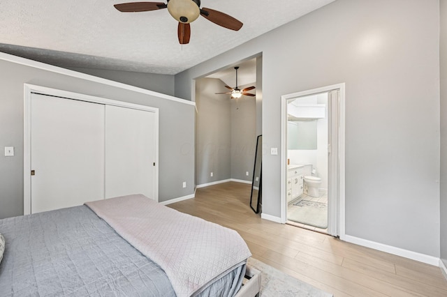 2361 Middlesex Rd, Upper Arlington, OH 43220 - bedroom with light wood finished floors, a closet, a ceiling fan, ensuite bath, and a textured ceiling