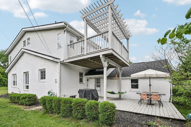2361 Middlesex Rd, Upper Arlington, OH 43220 - back of property featuring a wooden deck, a pergola, outdoor dining space, and brick siding
