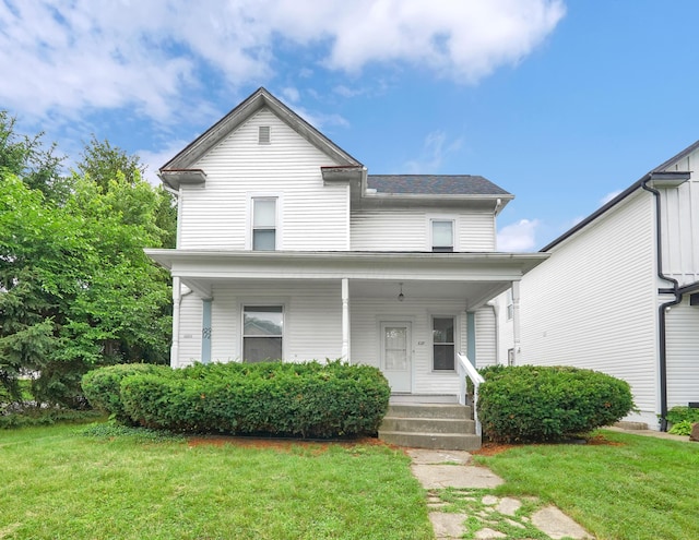 629 E Chestnut St, Lancaster, OH 43130 - view of front facade featuring covered porch and a front yard