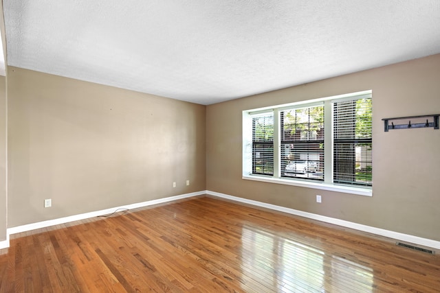 7701 Kelvinway Dr Unit 74, Columbus, OH 43085 - empty room featuring wood finished floors and a textured ceiling