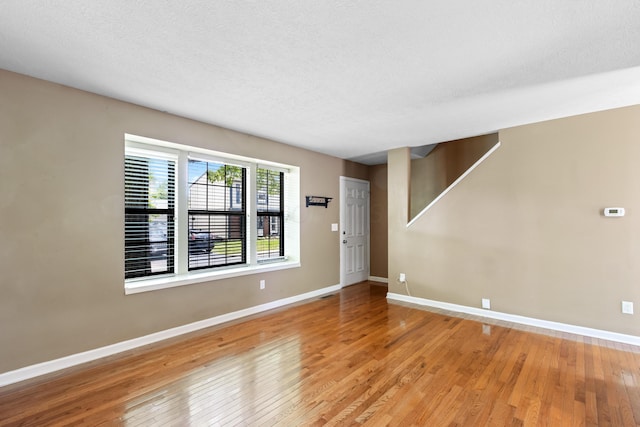 7701 Kelvinway Dr Unit 74, Columbus, OH 43085 - empty room with light wood-type flooring and a textured ceiling