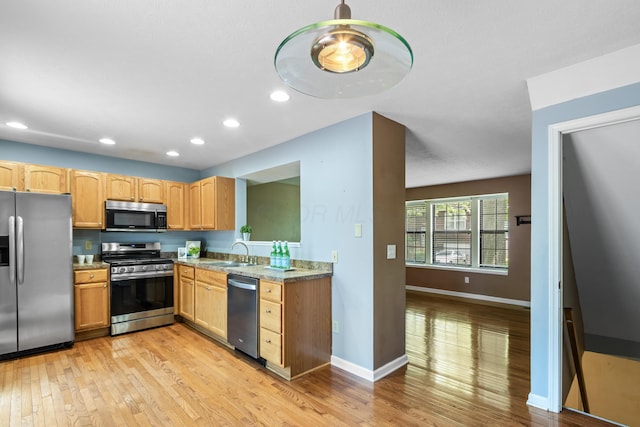 7701 Kelvinway Dr Unit 74, Columbus, OH 43085 - kitchen featuring stainless steel appliances, light wood-type flooring, and recessed lighting