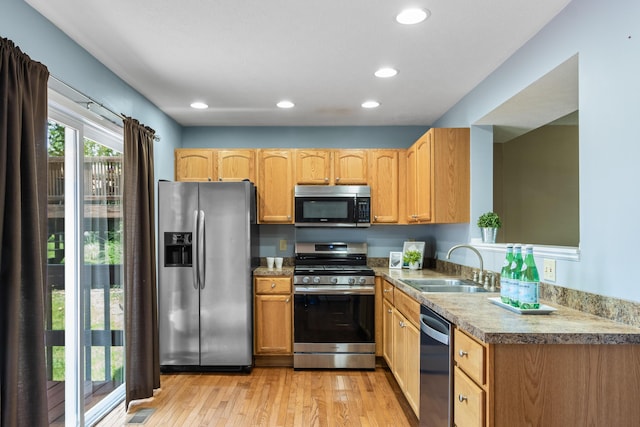7701 Kelvinway Dr Unit 74, Columbus, OH 43085 - kitchen featuring appliances with stainless steel finishes, light wood-style floors, recessed lighting, and light countertops