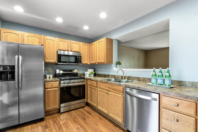 7701 Kelvinway Dr Unit 74, Columbus, OH 43085 - kitchen with stainless steel appliances, light wood-style flooring, recessed lighting, and light brown cabinets