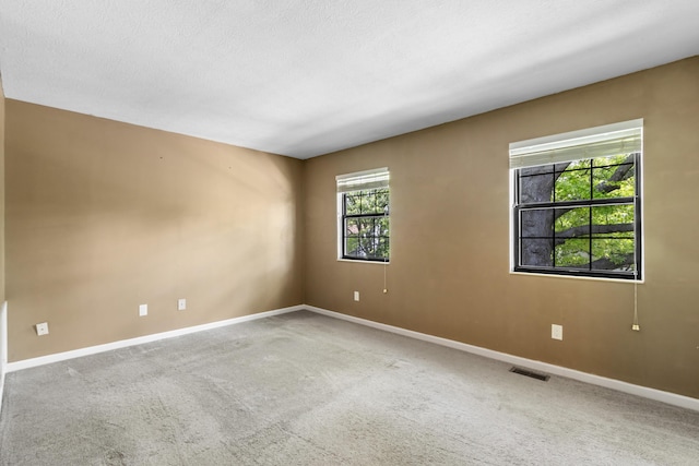 7701 Kelvinway Dr Unit 74, Columbus, OH 43085 - empty room with baseboards and carpet flooring