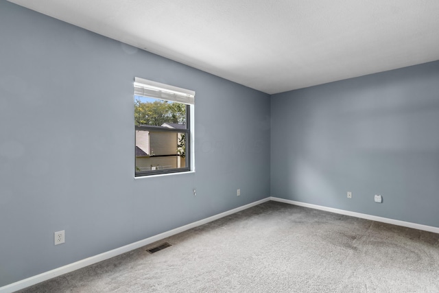 7701 Kelvinway Dr Unit 74, Columbus, OH 43085 - empty room with carpet flooring