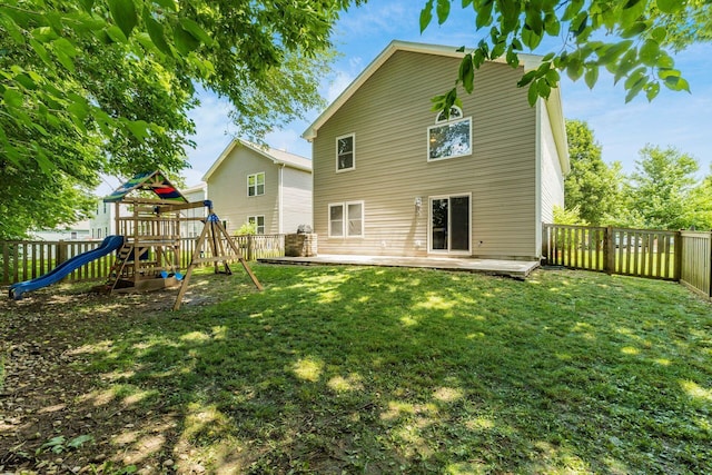 4867 Fosterson Dr, Lockbourne, OH 43137 - back of property featuring a playground and a fenced backyard