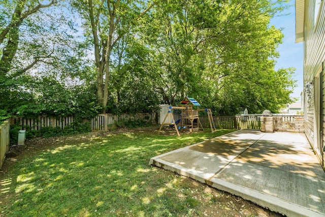 4867 Fosterson Dr, Lockbourne, OH 43137 - fenced backyard featuring a playground and a patio area