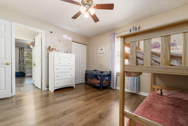 4867 Fosterson Dr, Lockbourne, OH 43137 - bedroom featuring wood finished floors, a closet, ceiling fan, and connected bathroom