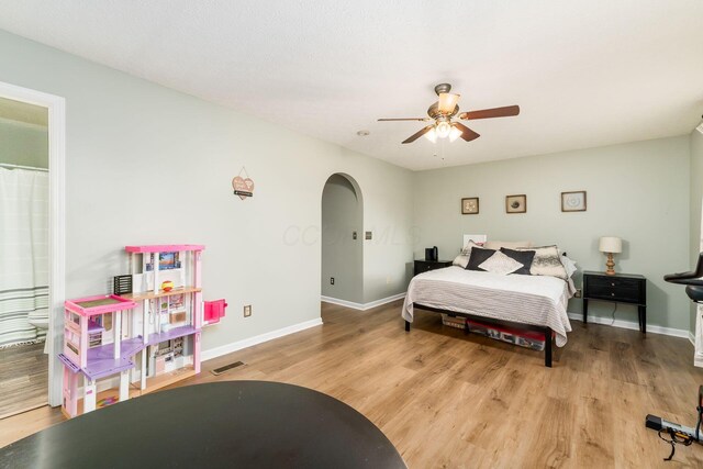 4867 Fosterson Dr, Lockbourne, OH 43137 - bedroom with wood finished floors, arched walkways, and ceiling fan