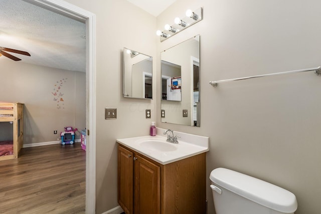 4867 Fosterson Dr, Lockbourne, OH 43137 - bathroom with ceiling fan, vanity, and wood finished floors