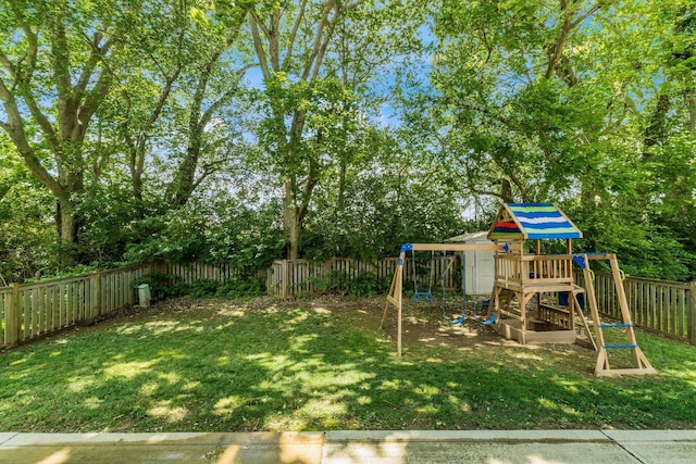 4867 Fosterson Dr, Lockbourne, OH 43137 - fenced backyard with a playground and view of scattered trees