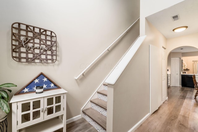 4867 Fosterson Dr, Lockbourne, OH 43137 - stairs with arched walkways and wood finished floors