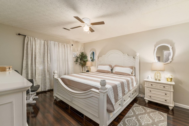 4867 Fosterson Dr, Lockbourne, OH 43137 - bedroom featuring dark wood-style floors, ceiling fan, and a textured ceiling