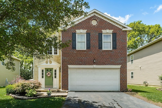 4867 Fosterson Dr, Lockbourne, OH 43137 - view of front of home featuring asphalt driveway, a garage, and brick siding