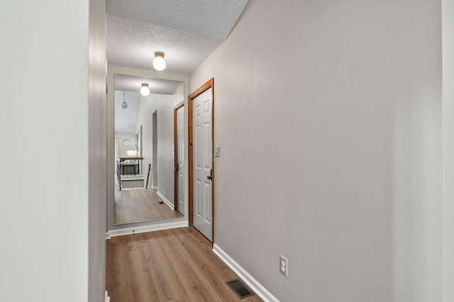 7982 Lewis Ave Unit 21, Dublin, OH 43017 - corridor with wood finished floors and a textured ceiling