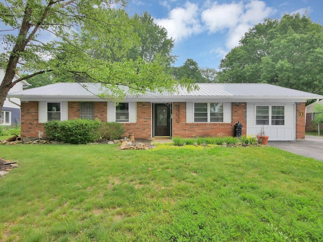 800 Spring Rd S, Westerville, OH 43081 - ranch-style home with brick siding, a front lawn, and a metal roof