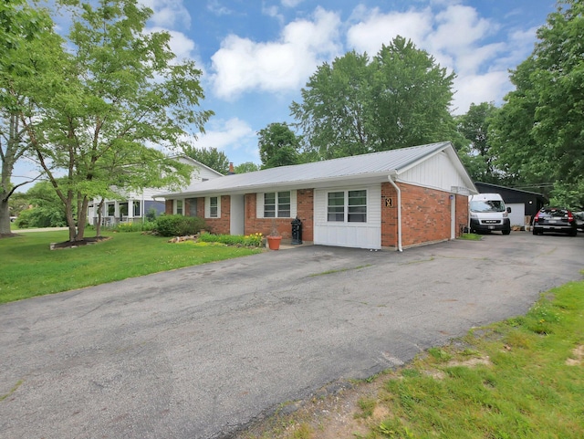 800 Spring Rd S, Westerville, OH 43081 - single story home with brick siding, a front yard, and a metal roof