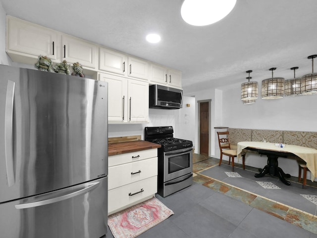 800 Spring Rd S, Westerville, OH 43081 - kitchen with appliances with stainless steel finishes, butcher block counters, white cabinets, and recessed lighting