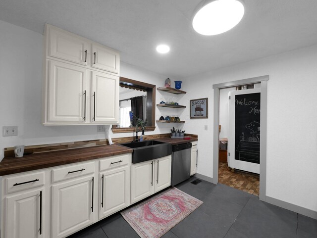 800 Spring Rd S, Westerville, OH 43081 - kitchen featuring butcher block counters, dishwasher, and white cabinetry