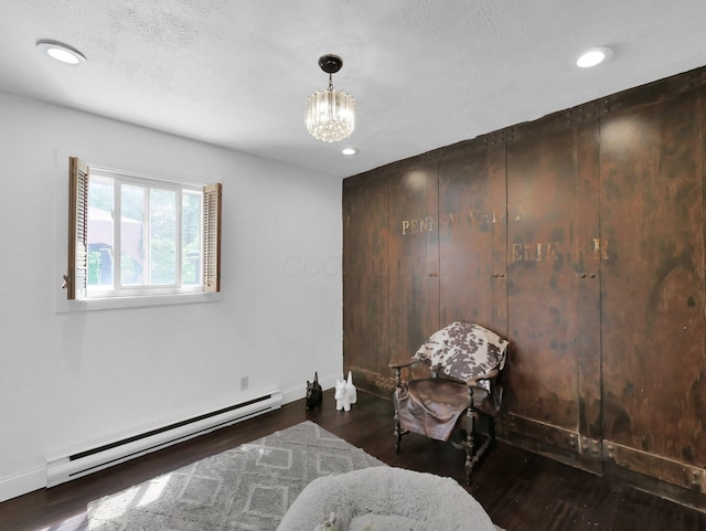 800 Spring Rd S, Westerville, OH 43081 - living area with a baseboard radiator, wood finished floors, a chandelier, and recessed lighting