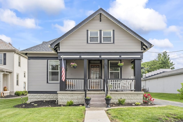 94 W Waterloo St, Canal Winchester, OH 43110 - view of front of property with covered porch, a front yard, and roof with shingles