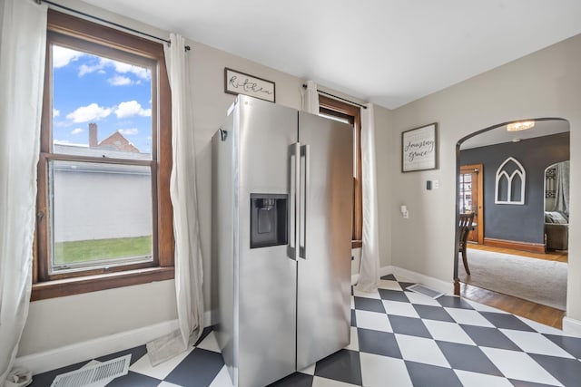 94 W Waterloo St, Canal Winchester, OH 43110 - kitchen with stainless steel fridge with ice dispenser, dark floors, arched walkways, and plenty of natural light