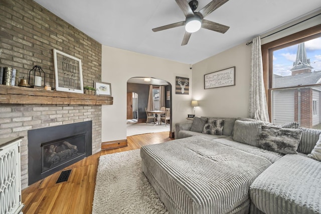 94 W Waterloo St, Canal Winchester, OH 43110 - bedroom with arched walkways, wood finished floors, and a brick fireplace
