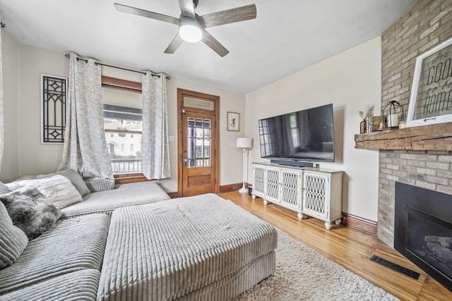 94 W Waterloo St, Canal Winchester, OH 43110 - bedroom with wood finished floors, a fireplace, and a ceiling fan