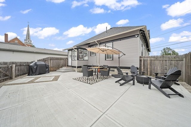 94 W Waterloo St, Canal Winchester, OH 43110 - back of property with a fire pit, a fenced backyard, roof with shingles, a patio area, and entry steps