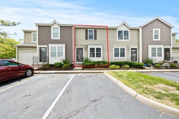 5153 Singleton Dr Unit 44B, Hilliard, OH 43026 - view of property featuring uncovered parking