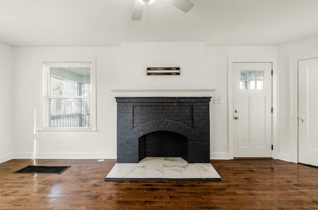 786 Ann St, Columbus, OH 43206 - unfurnished living room with healthy amount of natural light, wood finished floors, a ceiling fan, and a brick fireplace