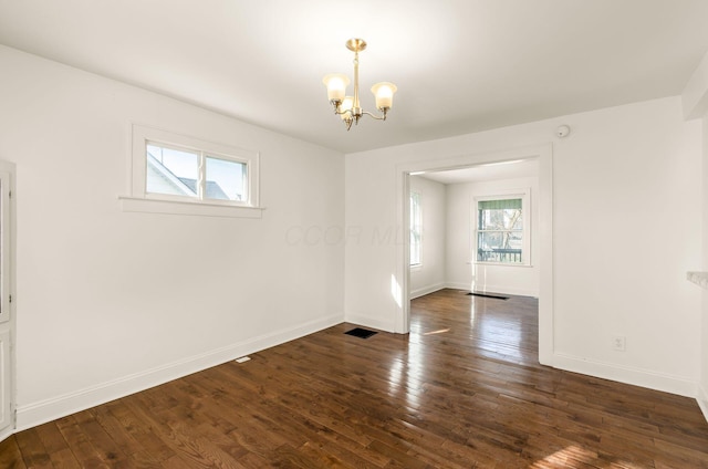 786 Ann St, Columbus, OH 43206 - spare room with a chandelier and dark wood-style flooring