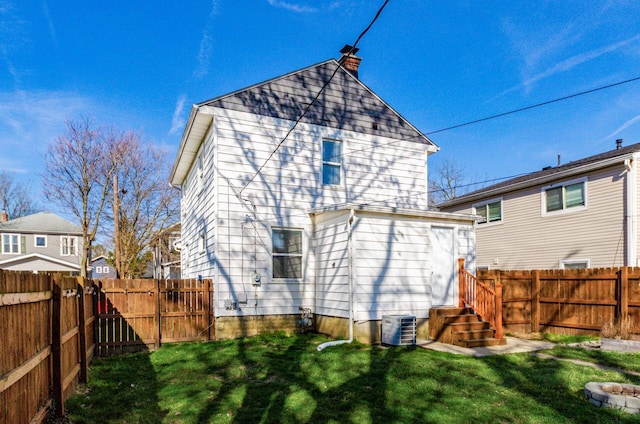 786 Ann St, Columbus, OH 43206 - back of house featuring a chimney, a fenced backyard, and entry steps