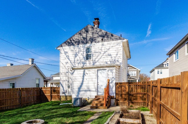 786 Ann St, Columbus, OH 43206 - back of house featuring entry steps, a chimney, and a fenced backyard