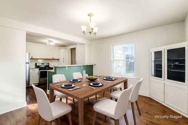 786 Ann St, Columbus, OH 43206 - dining space featuring a chandelier and dark wood-style floors