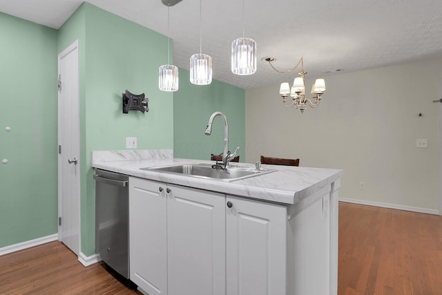 4686 Parrau Dr Unit 64A, Columbus, OH 43228 - kitchen featuring stainless steel dishwasher, a peninsula, dark wood-type flooring, light countertops, and white cabinetry