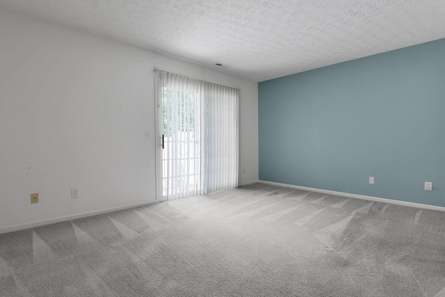 4686 Parrau Dr Unit 64A, Columbus, OH 43228 - carpeted spare room with baseboards and a textured ceiling