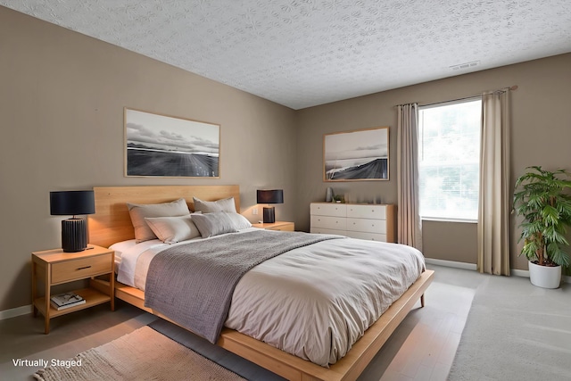 4686 Parrau Dr Unit 64A, Columbus, OH 43228 - bedroom with baseboards and a textured ceiling