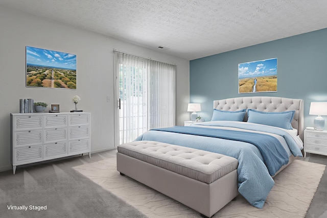 4686 Parrau Dr Unit 64A, Columbus, OH 43228 - bedroom featuring access to exterior and a textured ceiling
