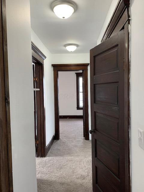 86 Curtis Ave, Newark, OH 43055 - hallway with light carpet and baseboards