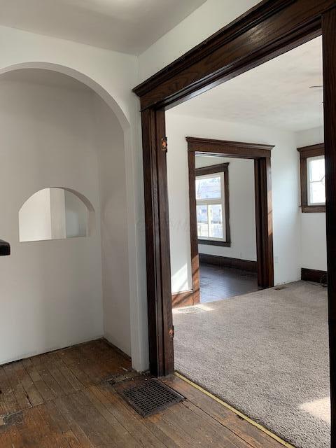 86 Curtis Ave, Newark, OH 43055 - hallway featuring hardwood / wood-style floors and arched walkways