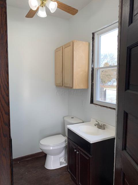 86 Curtis Ave, Newark, OH 43055 - half bathroom with vanity, wood finished floors, and a ceiling fan
