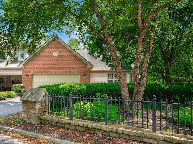 6003 Dunabbey Loop, Dublin, OH 43017 - traditional-style house with a garage, brick siding, and a shingled roof