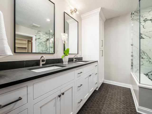 6003 Dunabbey Loop, Dublin, OH 43017 - bathroom with double vanity and a textured ceiling
