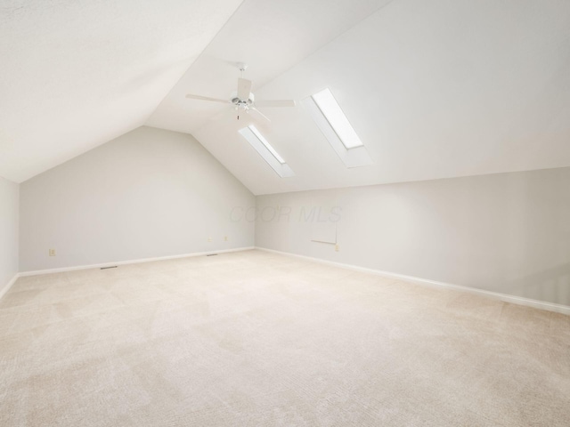 6003 Dunabbey Loop, Dublin, OH 43017 - additional living space featuring a skylight, lofted ceiling, ceiling fan, and light carpet