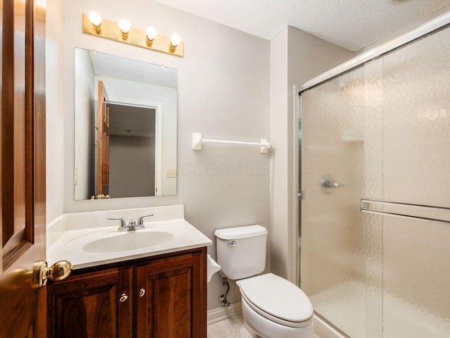 6003 Dunabbey Loop, Dublin, OH 43017 - full bathroom featuring vanity, a stall shower, tile patterned flooring, and a textured ceiling