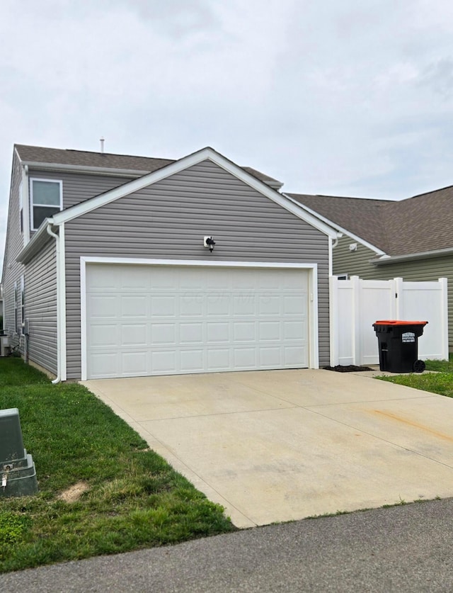 91 Neptune Ave, Newark, OH 43055 - view of front of house with concrete driveway and a garage