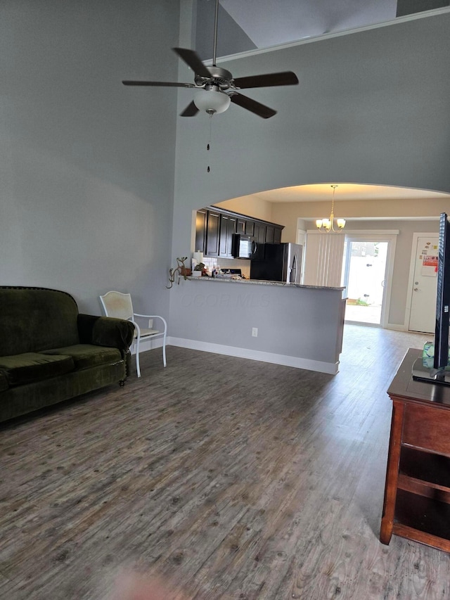 91 Neptune Ave, Newark, OH 43055 - living area with high vaulted ceiling, ceiling fan, a chandelier, and wood finished floors